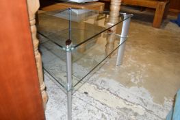 A glass two tier corner TV stand.