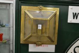 A pair of industrial style brass wall mounted lamps.