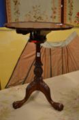 A Chippendale style carved mahogany birdcage tripod table.