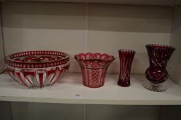 A good ruby tinted cut glass circular bowl and three similar items.