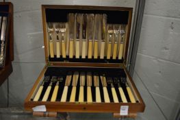 A cased set of twelve fish knives and forks.