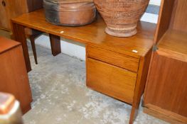 A teak pedestal desk.
