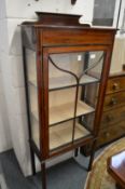 An Edwardian inlaid mahogany display cabinet.