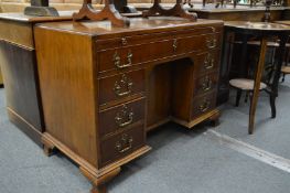 A George III design mahogany kneehole desk.