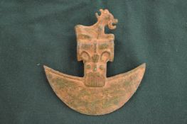 A bronze archaic form axe head.