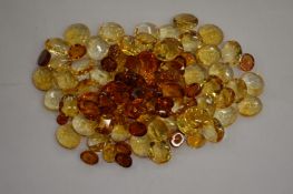 A box of topaz and citrine stones.