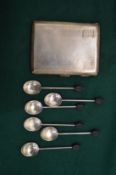 A silver cigarette case and six silver coffee bean spoons.