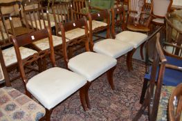 A set of four Regency style mahogany dining chairs.