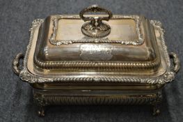 An impressive silver plated entree dish, cover and stand with applied engraved armorial.