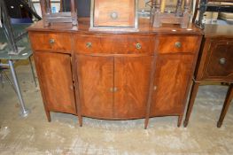 A reproduction mahogany sideboard.