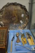 A plated salver and a small group of cutlery.