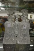 A pair of cut glass decanters.