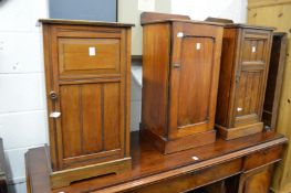Three walnut pot cupboards.