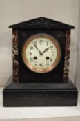 A Victorian slate mantle clock.