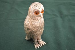 A novelty sugar caster modelled as an owl.