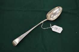 A silver basting spoon.