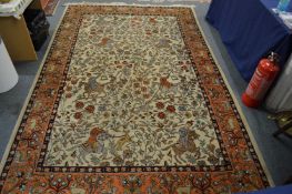 An Indian beige ground hunting carpet.