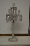 A frosted and cut glass figural candelabra.