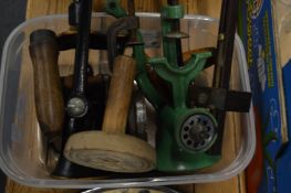 A small group of bygones to include hand mincers, shortbread mould etc.