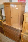 An oak hanging corner cupboard and an oak chest of drawers.