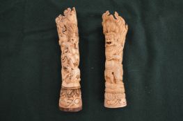 Two carved bone figures.