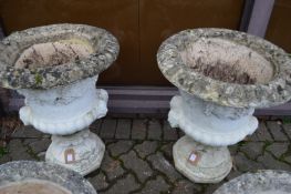 A good pair of urn shaped pedestal garden planters.