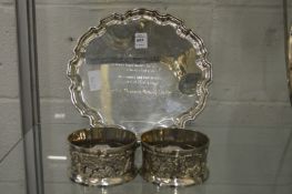 A plated salver and a pair of bottle coasters.