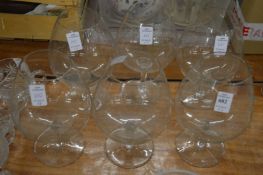 Six large brandy balloons.