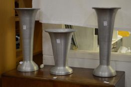 Three aluminium vases.