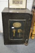 A small cast iron safe by E. Whitfield & Co, Birmingham.