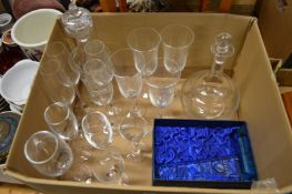 Two cut glass decanters and other glassware.