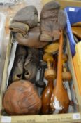 Old sporting equipment to include a pair of leather boxing gloves, football boots, football, rugby