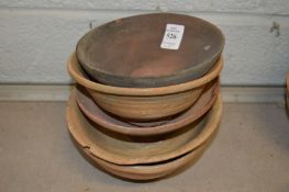 Five Chinese terracotta bowls.