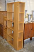 A modern oak laminated bookcase / display unit.