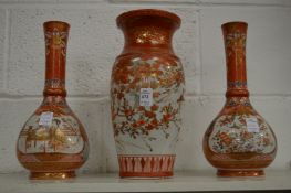 A Japanese Kutani baluster shaped vase together with a pair of similar bottle vases.