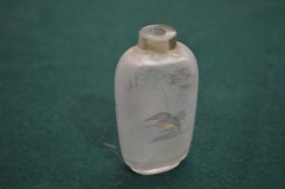 A Chinese reverse painted glass snuff bottle.