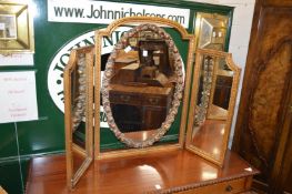 A large gilt framed folding dressing table mirror.