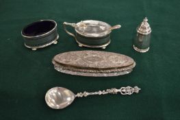 A silver oval mustard pot with pierced sides, together with a matching salt, a pepperette, a