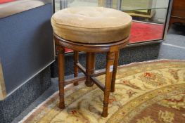 A 19th century mahogany revolving music seat.