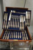 A mahogany cased set of eighteen dessert knives and forks.