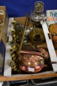A copper kettle, brass candlesticks and other metalware.