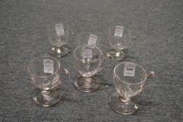 Two sets of three glass custard cups.