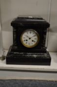 A Victorian slate mantle clock.