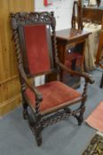 A 18th century walnut framed high back armchair.
