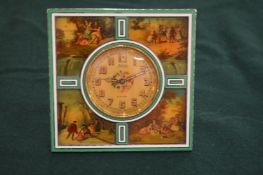 A small French silver and enamel clock.