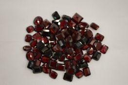 A box of unmounted garnets.