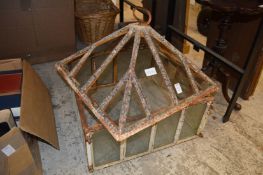 An old cast iron and glazed cloche.