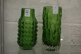 Two Whitefriars green glass vases, a pineapple vase and a bark vase.