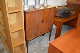 A rosewood two door floor standing cocktail cabinet.