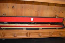 A cased snooker cue.